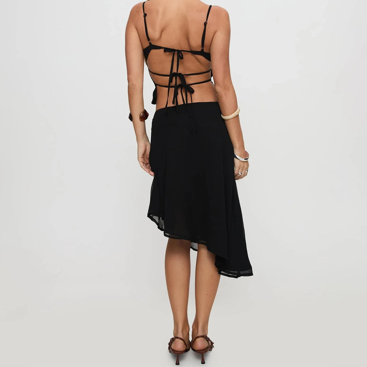 Black 2-piece women's matching clothing set by Corporación Turística, featuring a stylish top and matching bottoms.