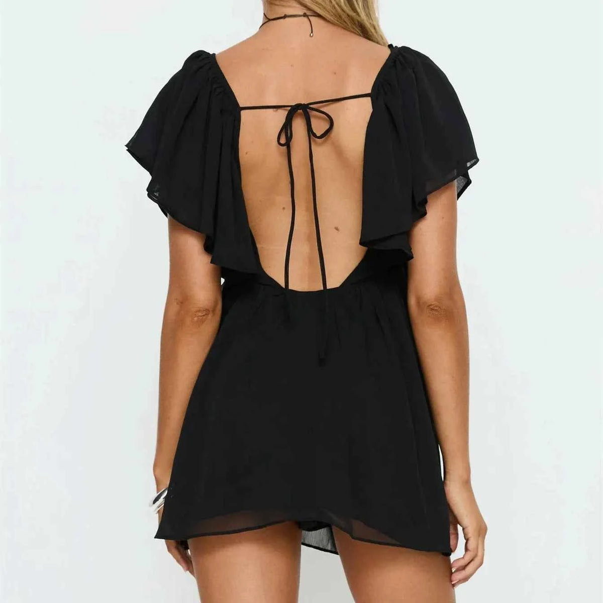 Black summer dress for women, casual mini dress with ruffled details by Corporación Turística, ideal for warm weather.