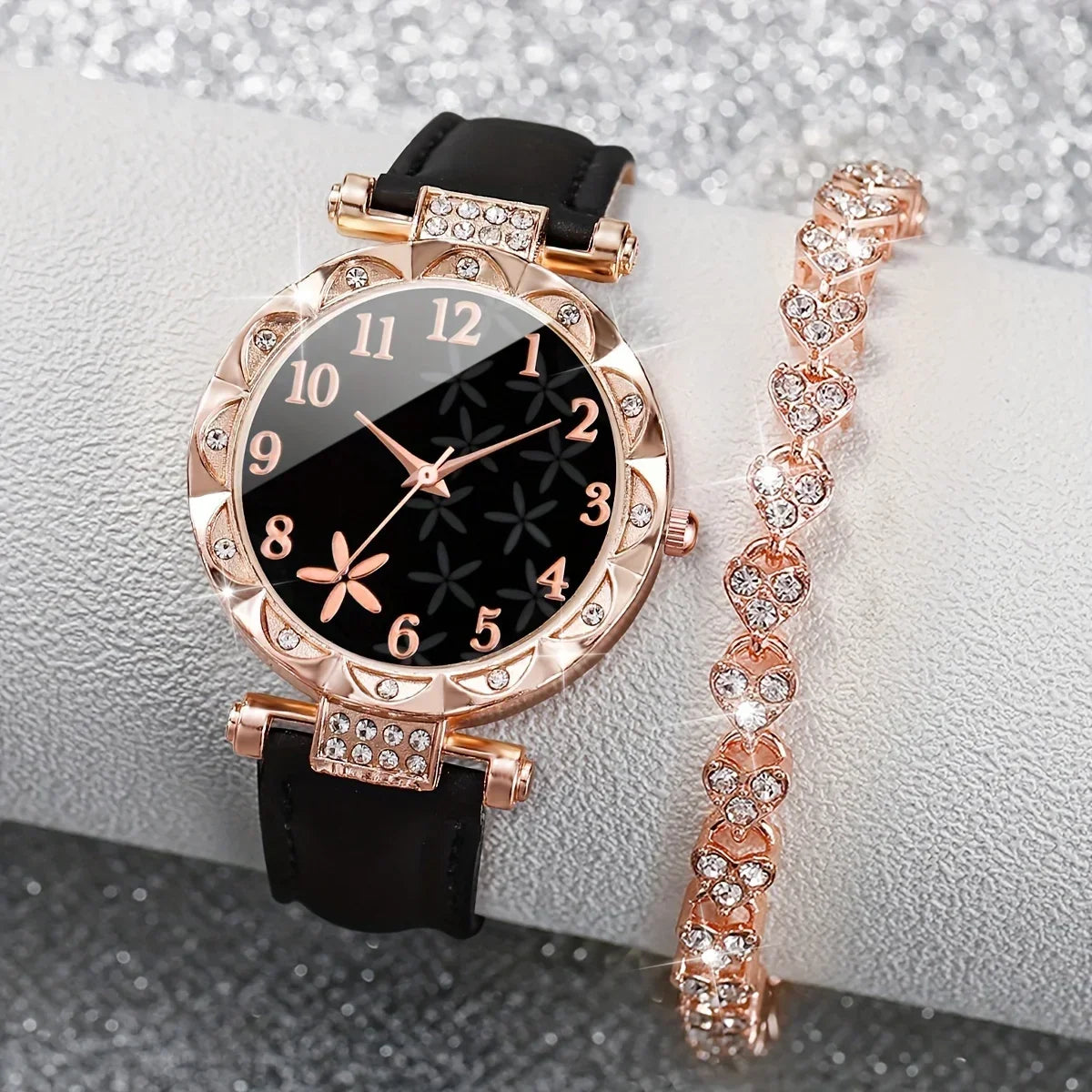Two fashionable black quartz watches with diamond accents from Corporación Turística, showcasing elegant design and craftsmanship.