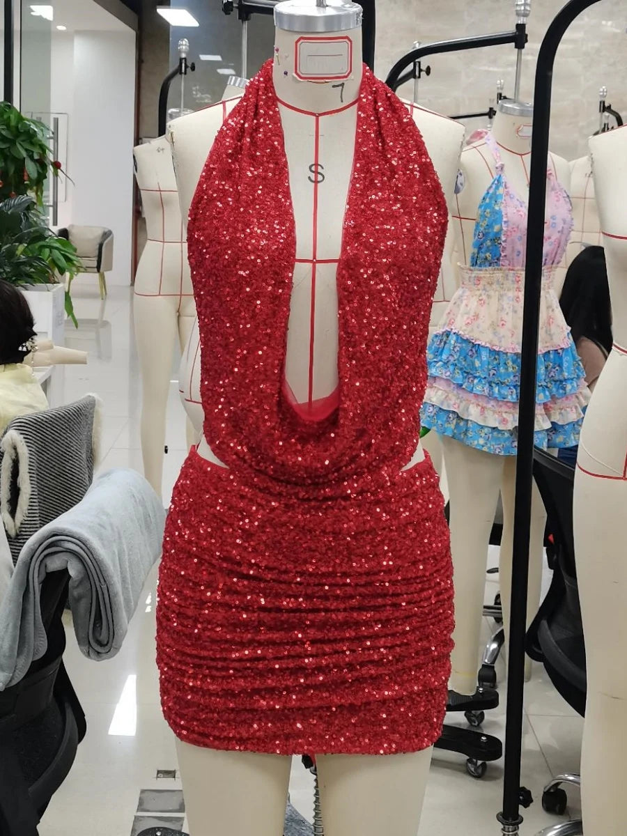 Two-piece sexy sequin costume set in black, featuring shiny, glittering fabric for a bold, glamorous look.