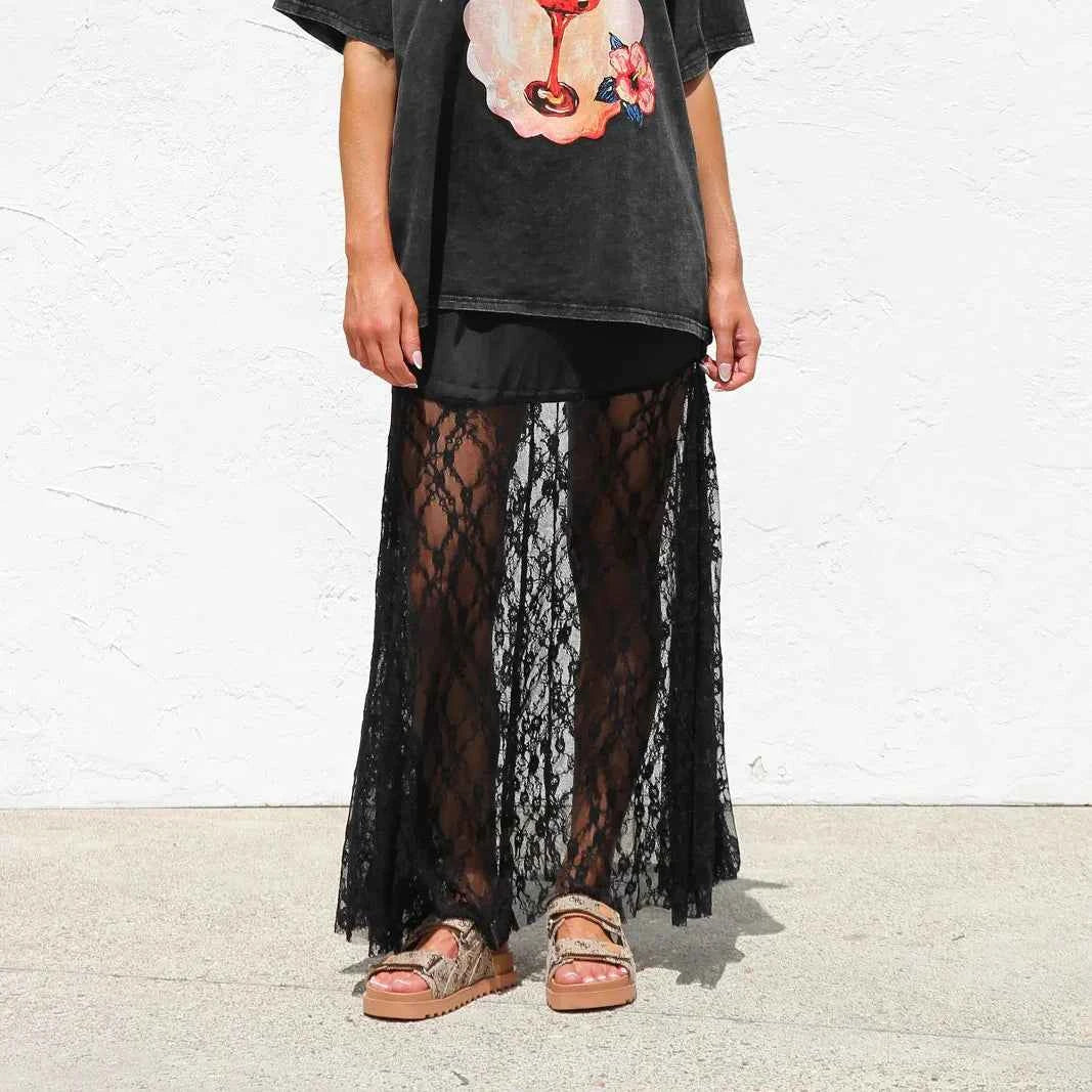 Black boho long summer skirt for women with lace details, stylish and flowing, perfect for warm weather and casual occasions.
