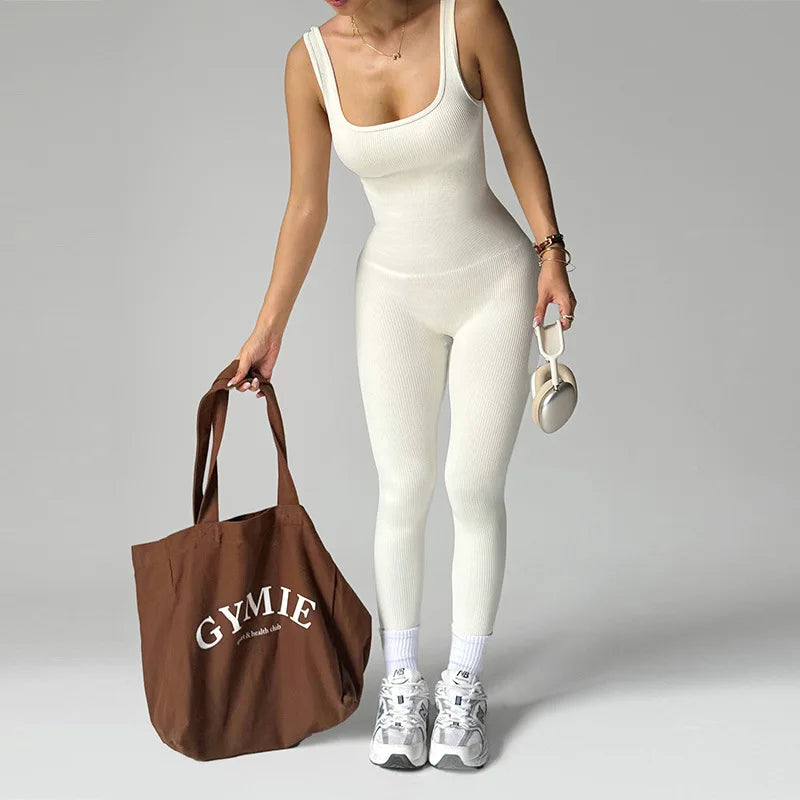 Black women’s one-piece sports jumpsuit by Corporación Turística, seamless design, comfortable athletic wear.