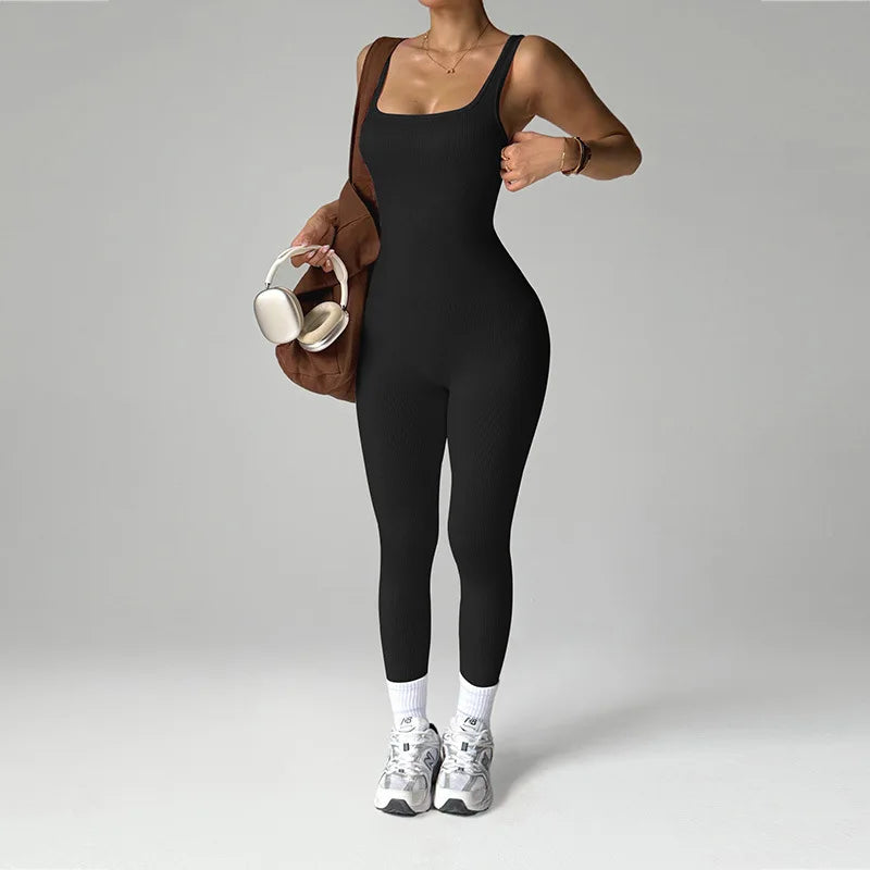 Black women's one-piece seamless sports jumpsuit by Corporación Turística, designed for active wear and comfort.