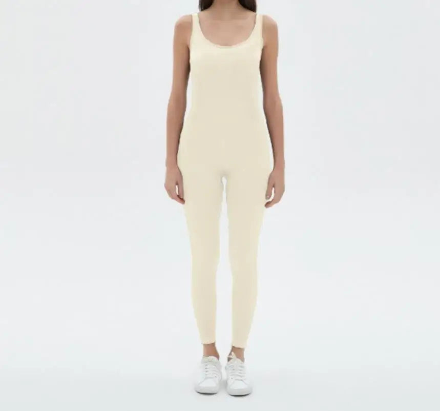 Black women's one-piece sports jumpsuit by Corporación Turística, seamless, fitted athletic wear for active use.