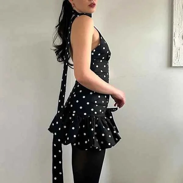 Summer dress for women by Corporación Turística, black sleeveless V-neck dress with colorful printed design.