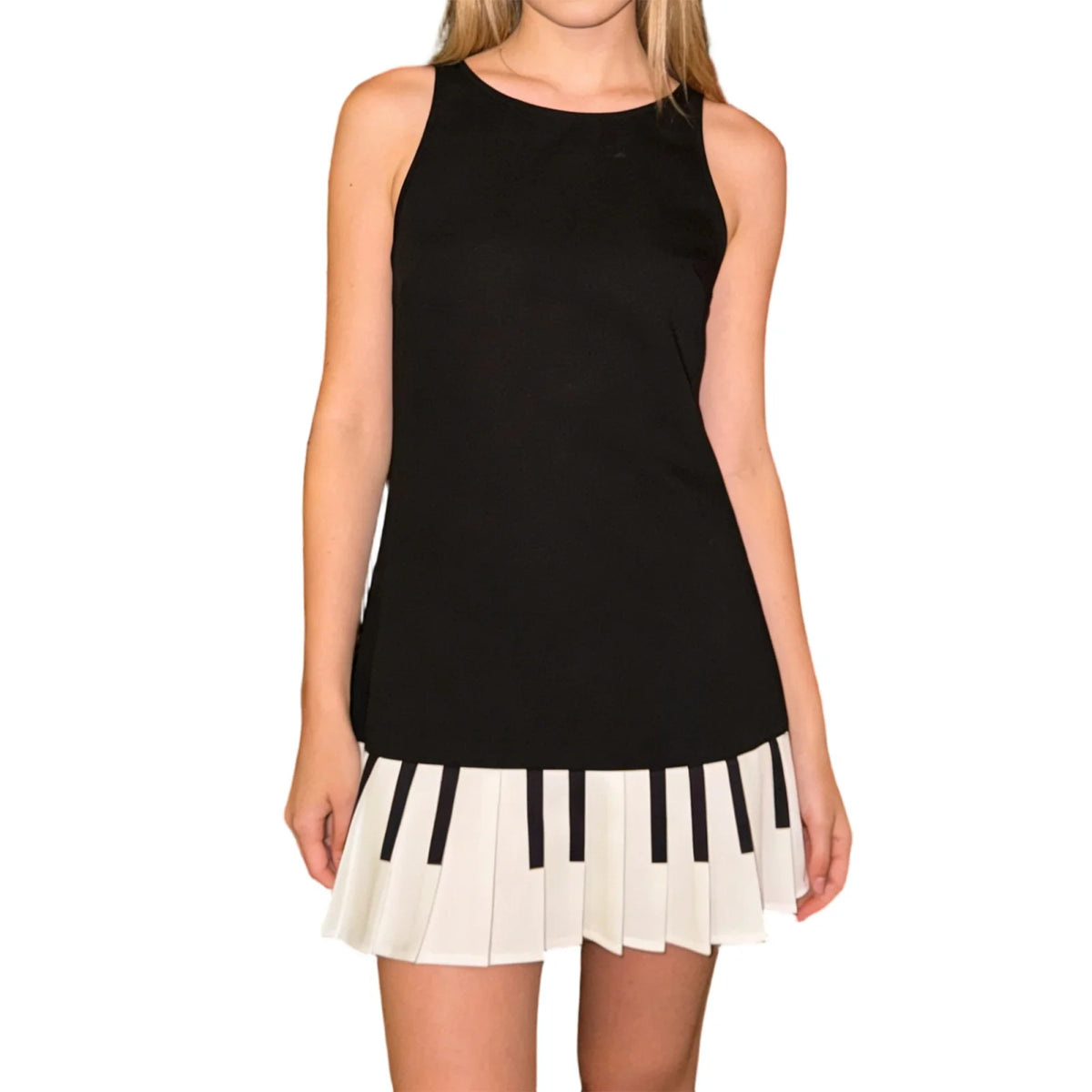 Black sleeveless women's dress by Corporación Turística, fitted and pleated, showcasing a sleek and stylish design.