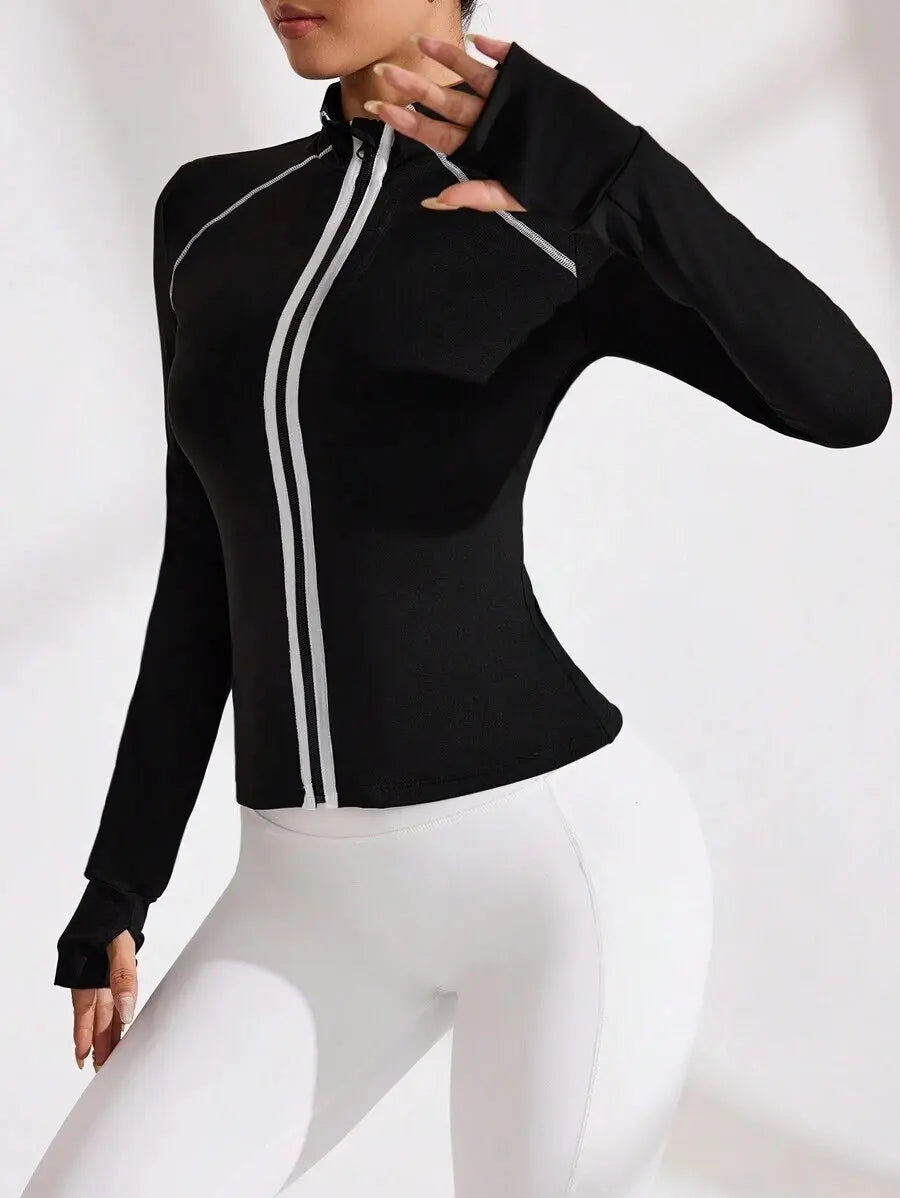 Black women's yoga jacket with front zipper and collar by Corporación Turística, shown on a mannequin.