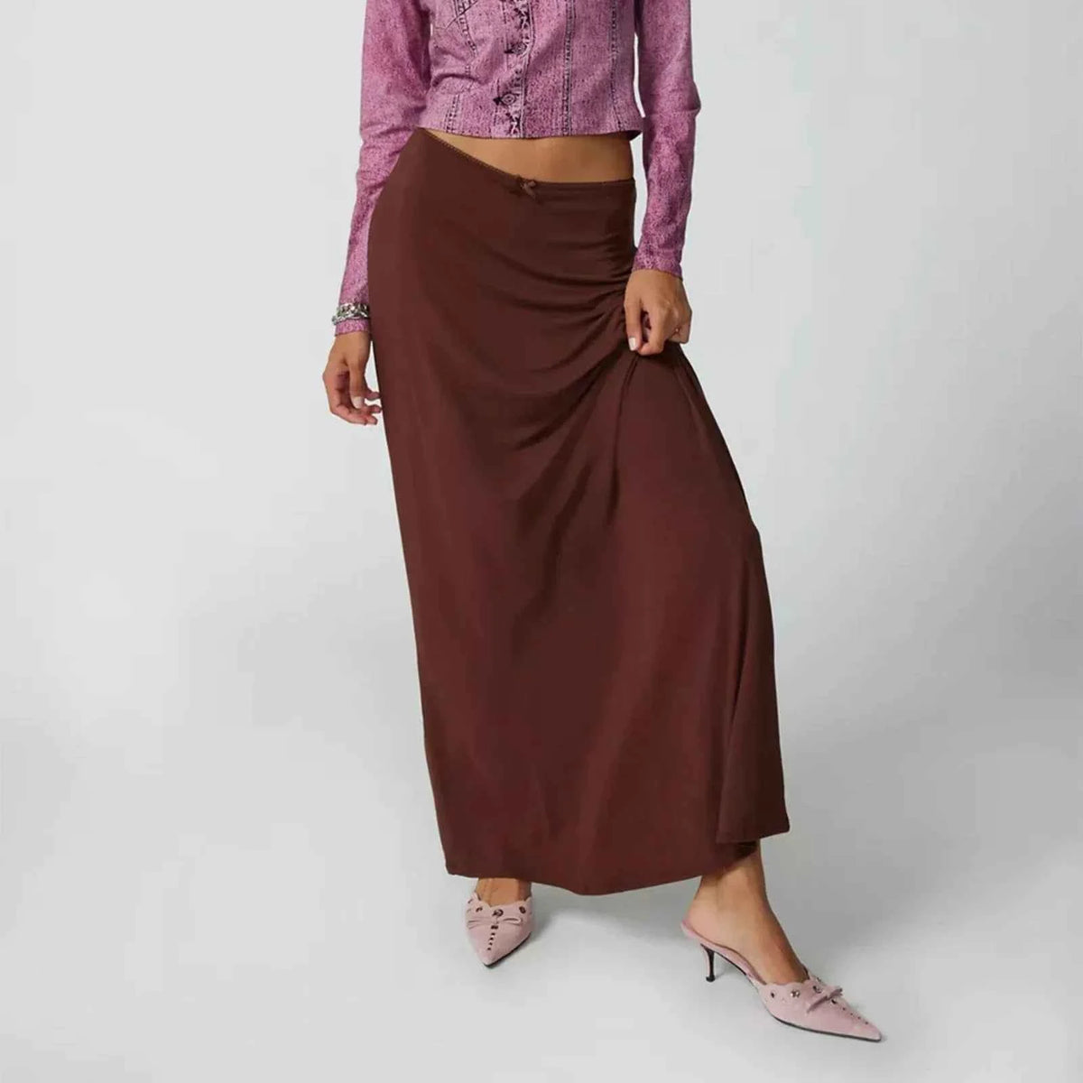 Long casual black skirts for women, straight fit, by Corporación Turística, shown hanging or laid flat.