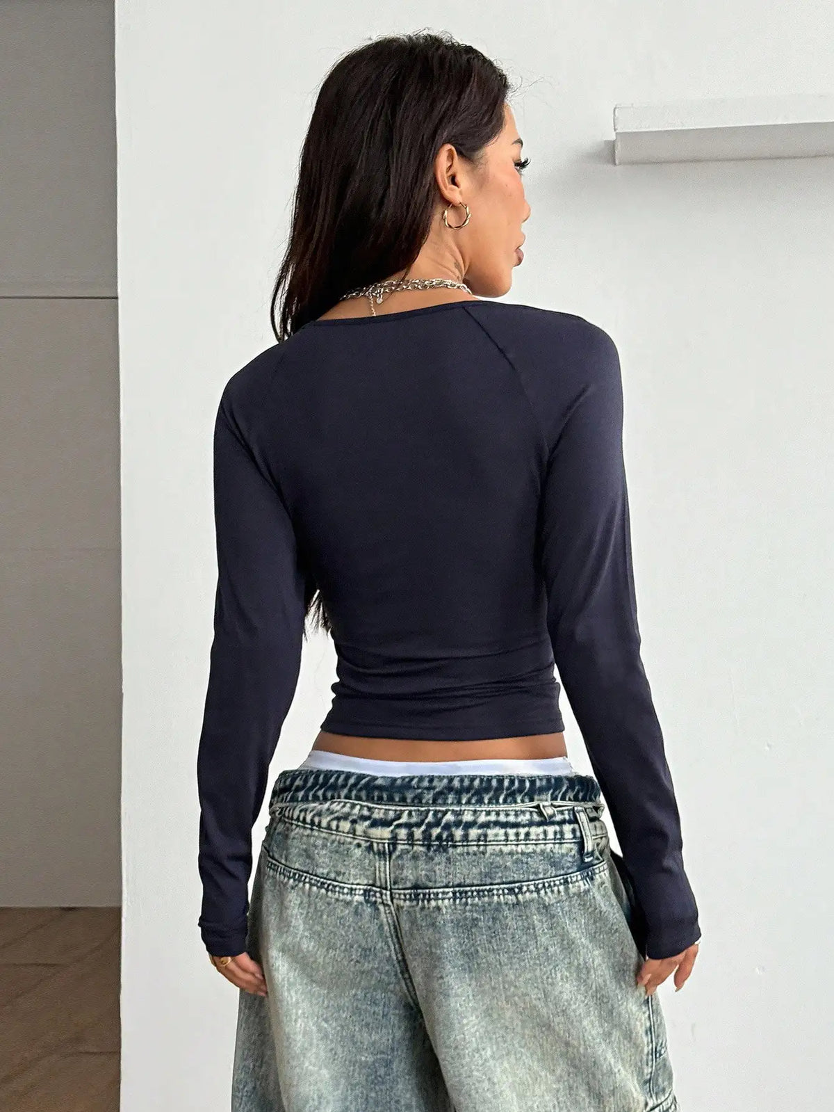 Black Y2K casual women's T-shirt from Corporación Turística featuring breathable fabric and a relaxed fit.