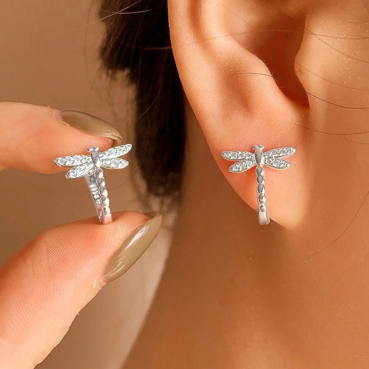 Silver S925 hoop earrings featuring delicate libélula and circular accents, crafted by Corporación Turística.