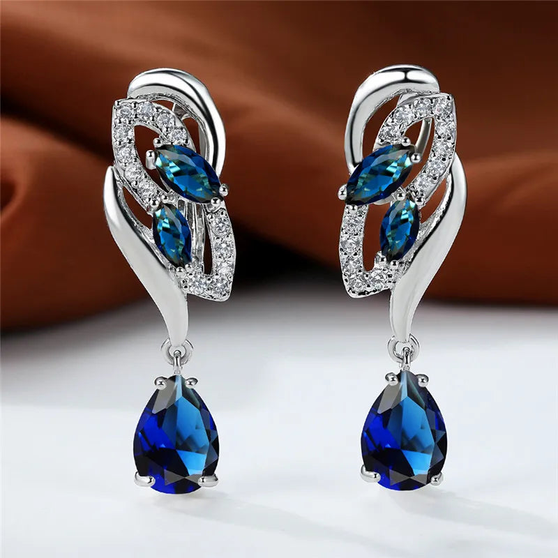 Luxury blue rainbow stone earrings for women featuring elegant design, showcasing vibrant multicolor gemstones and gold accents.
