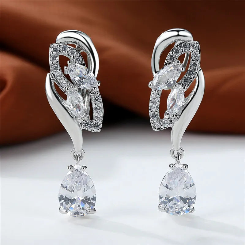 Luxury blue rainbow stone earrings for women, featuring elegant arch-shaped design and vibrant gemstone details.