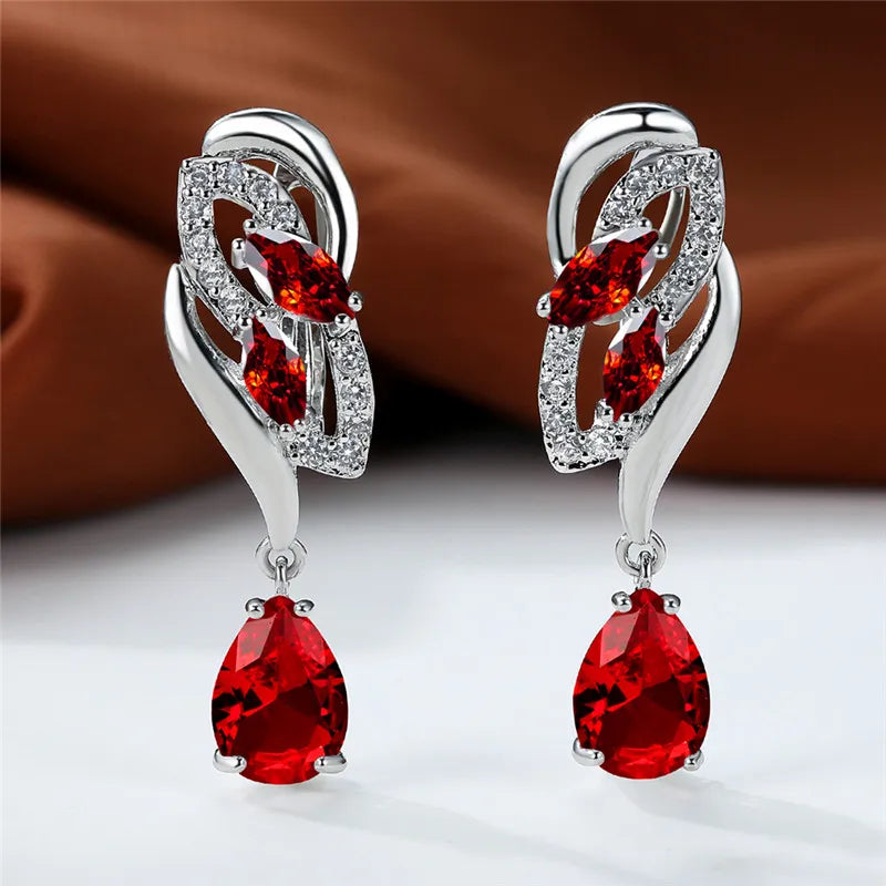 Blue rainbow stone luxury earrings for women, featuring elegant arch-shaped design with vibrant gemstone details.