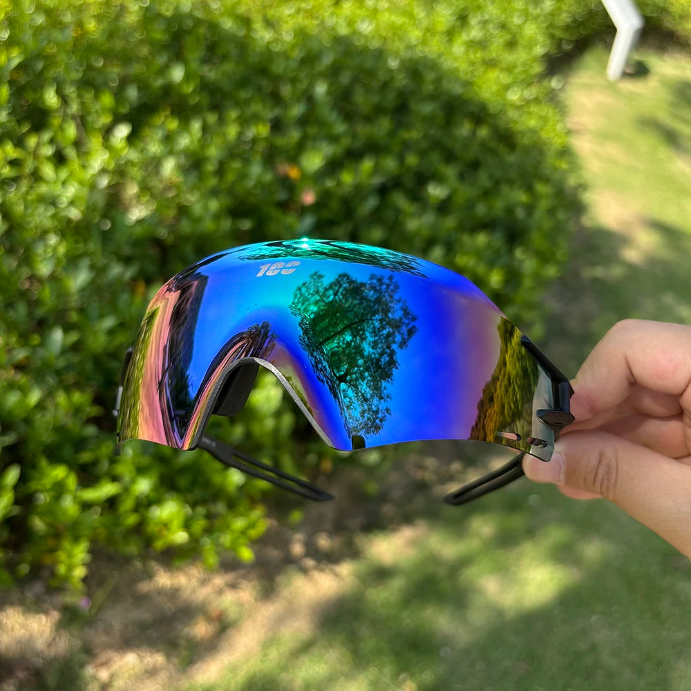 Photo of Corporación Turística photochromic cycling glasses with UV400 protection, suitable for mountain biking, road cycling, and running.