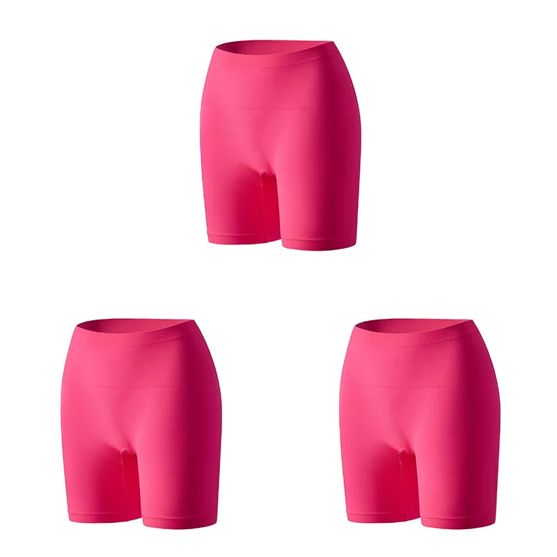 Set of three orange women's safety shorts by Corporación Turística, featuring durable fabric and adjustable waistbands.