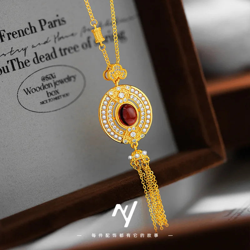 Gold collar de clavícula para mujer con borla de rubí ovalado, elegante accesorio de Corporación Turística.