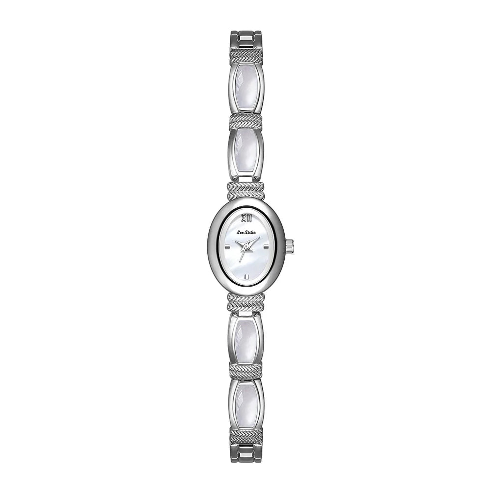 Gold women's bracelet watch with oval dial and elegant design by Corporación Turística, shown in a presentation box.