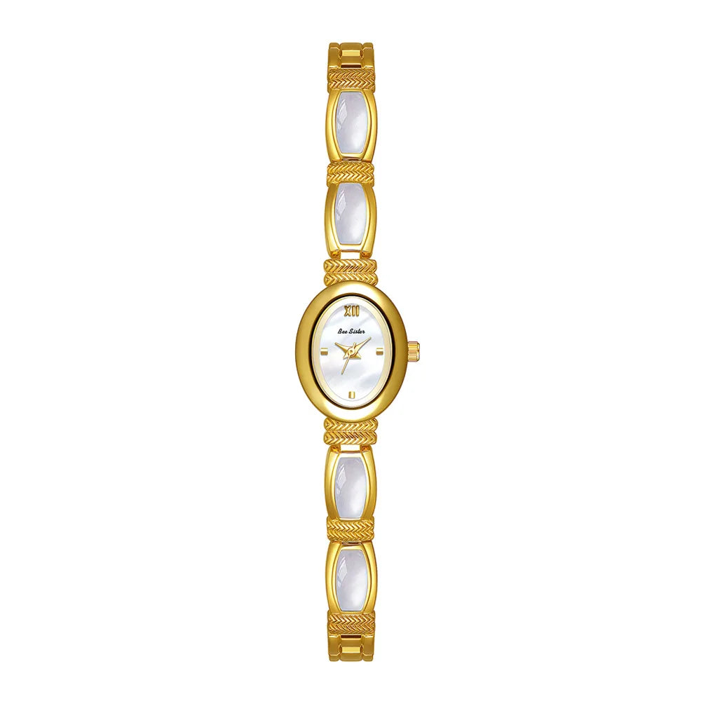 Gold oval-dial women's wristwatch by Corporación Turística with elegant design and matching jewelry box.