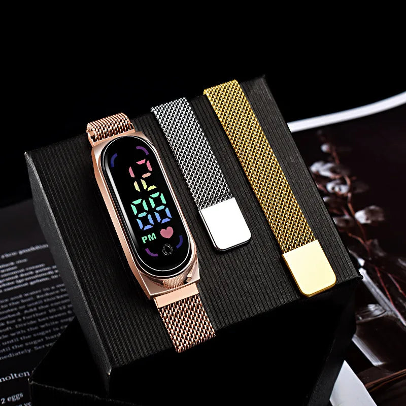 Gold LED magnetic electronic watch with alloy bracelet by Corporación Turística, close-up view showing digital display and sleek design.