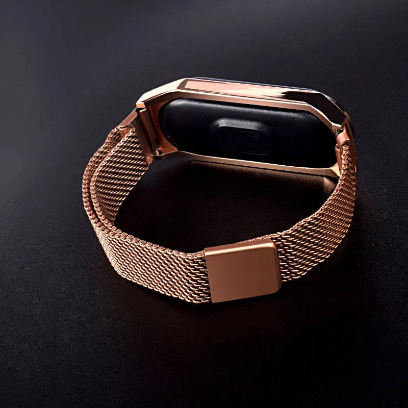 Gold LED magnetic electronic watch with alloy bracelet from Corporación Turística, stylish and modern wrist accessory.