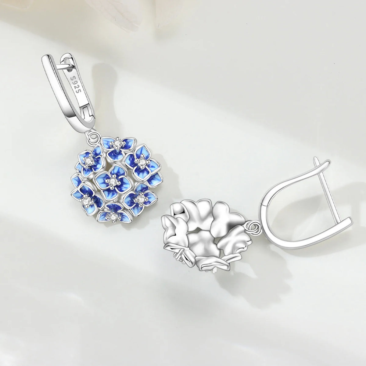 Silver 925 Hortensia flower earrings with blue floral design, elegant jewelry by Corporación Turística.