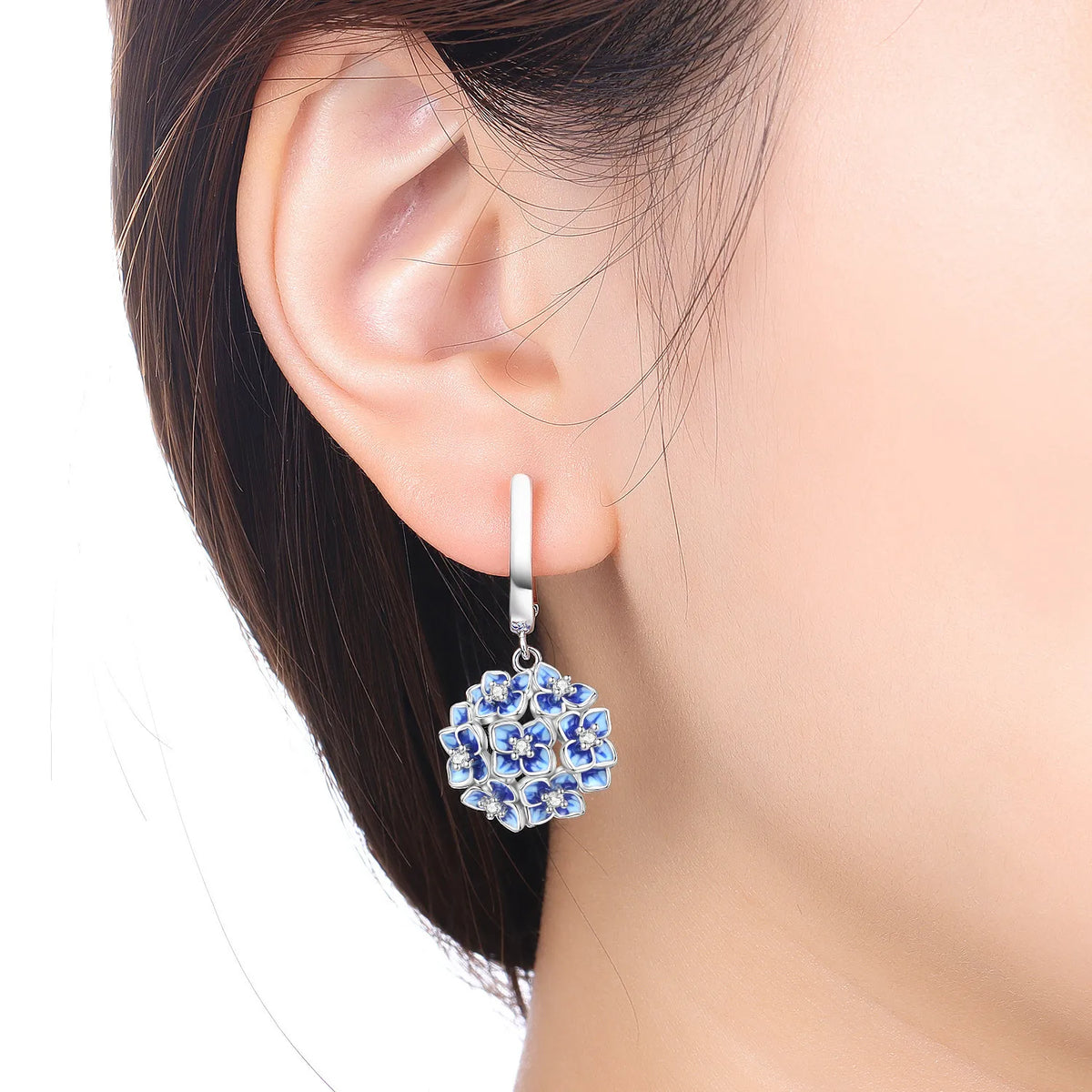 Sterling silver 925 earrings featuring blue hydrangea flower design, elegant jewelry by Corporación Turística.
