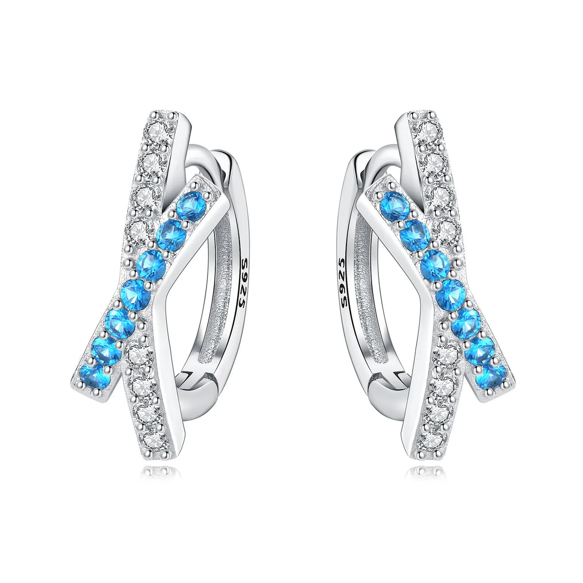 Sterling silver Orstarry earrings with blue cubic zirconia by Corporación Turística, featuring round gemstone and delicate design.