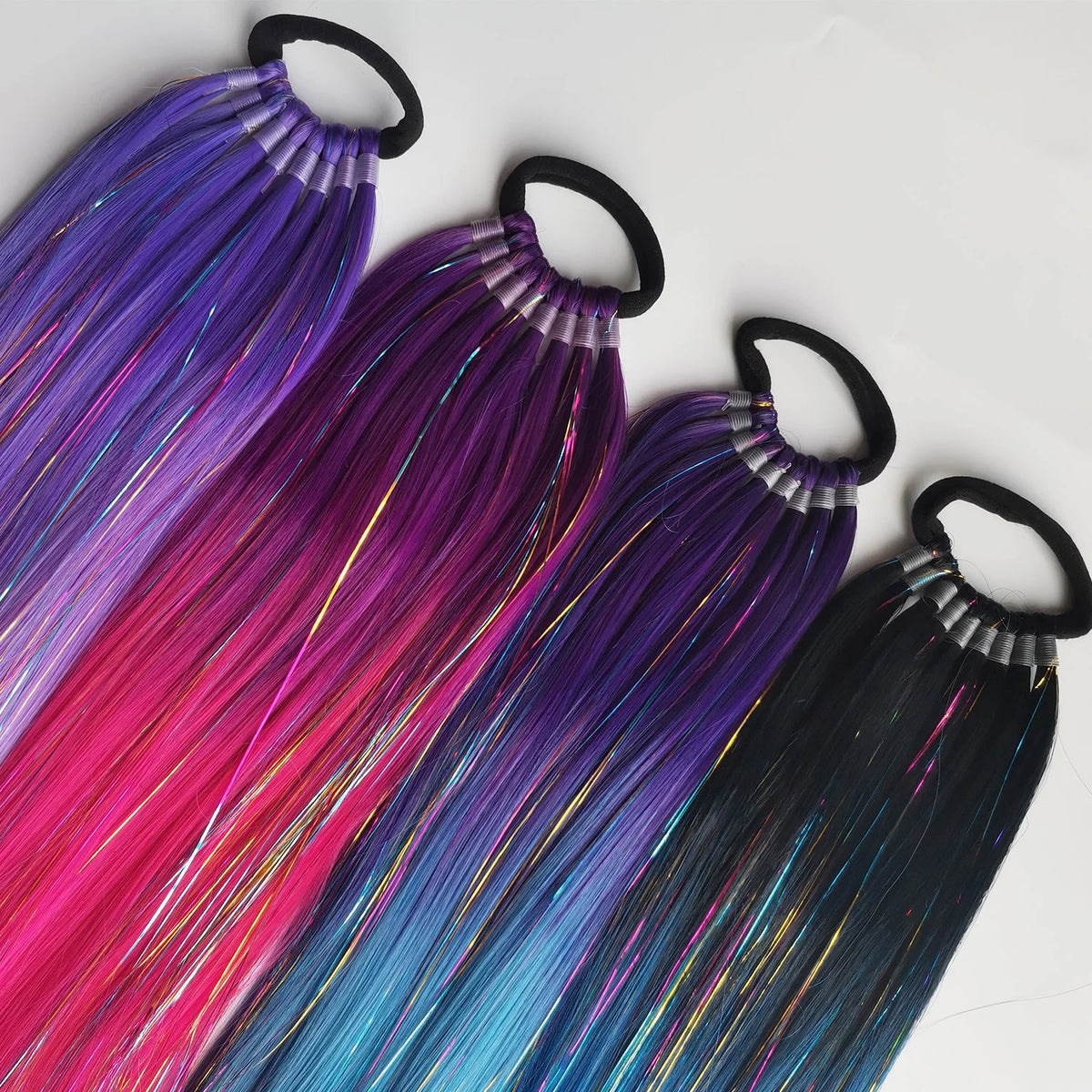 Colorful 24-inch purple, red, and gold metallic ponytail extension with curled design for festive or costume wear.