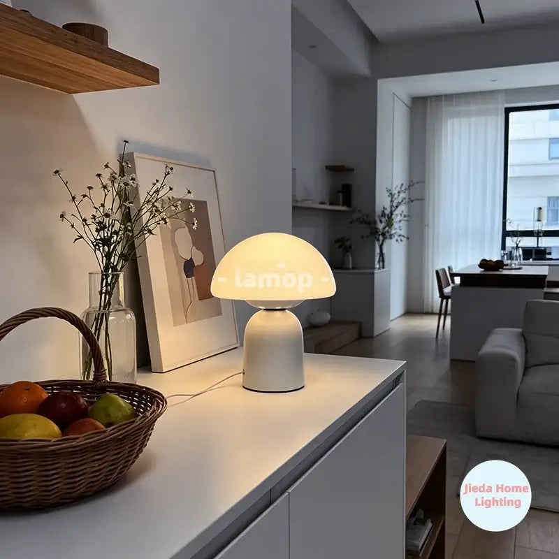 Murano glass mushroom-shaped table lamp with Cove design, illuminated, by Corporación Turística, featuring a sleek modern look.