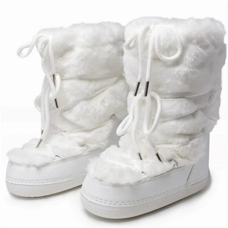 Pink high-end women's snow boots from Corporación Turística, showing the stylish winter footwear with thick soles and cozy design.