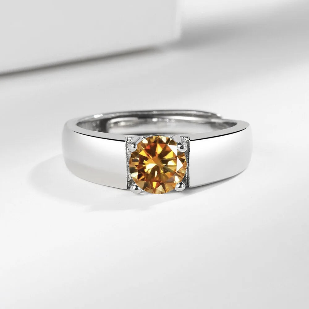 Sterling silver 925 men's moissanite ring with pink accents, featuring a polished band and sparkling gemstone.