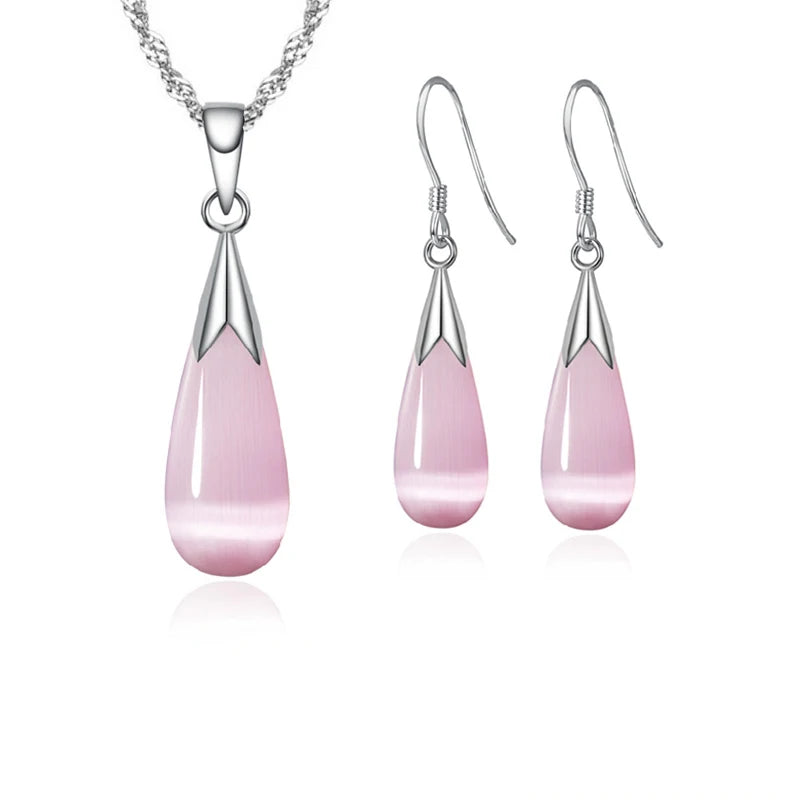 Simple sterling silver jewelry set in pink, featuring a necklace and earrings, made of 925 Ley silver from Corporación Turística.