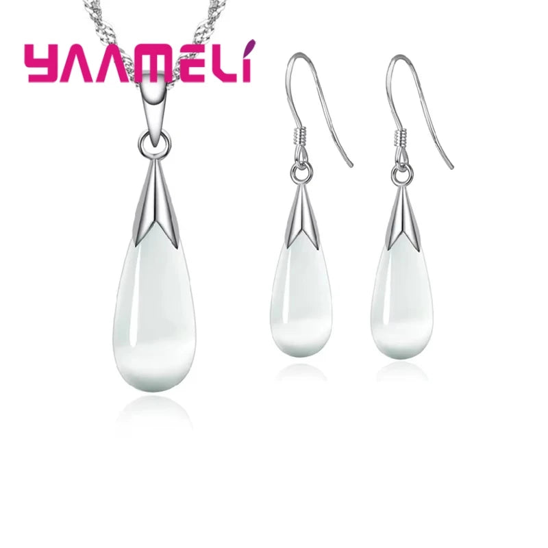 Elegant jewelry set in pure 925 silver with pink accents, featuring a simple design from Corporación Turística.