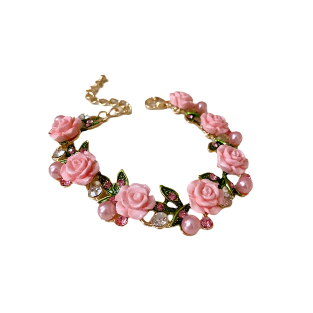 Luxury pink floral necklace with imitation diamonds, featuring intricate design and vibrant rose-colored flowers.