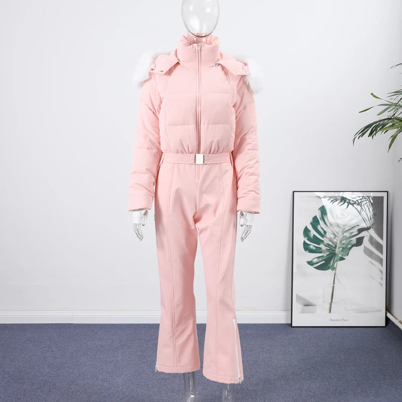 Elegant pink women's ski jumpsuit with thick leather material, designed for warmth and style by Corporación Turística.