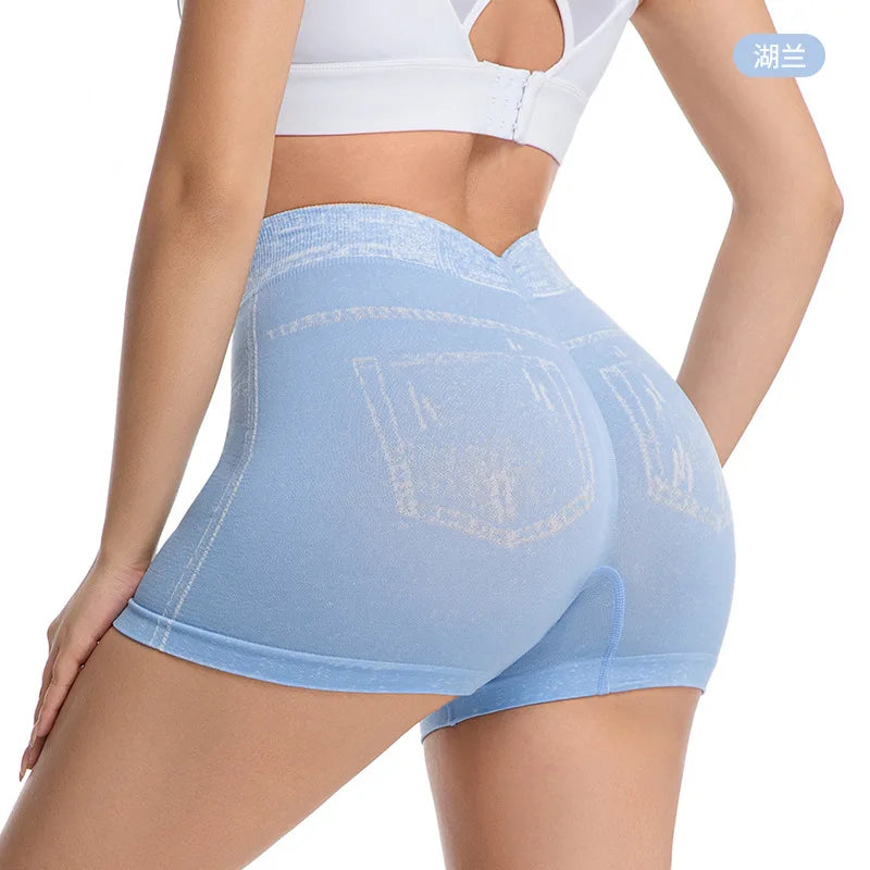 Pink denim-look women's sports shorts by Corporación Turística, featuring a casual and comfortable athletic style.