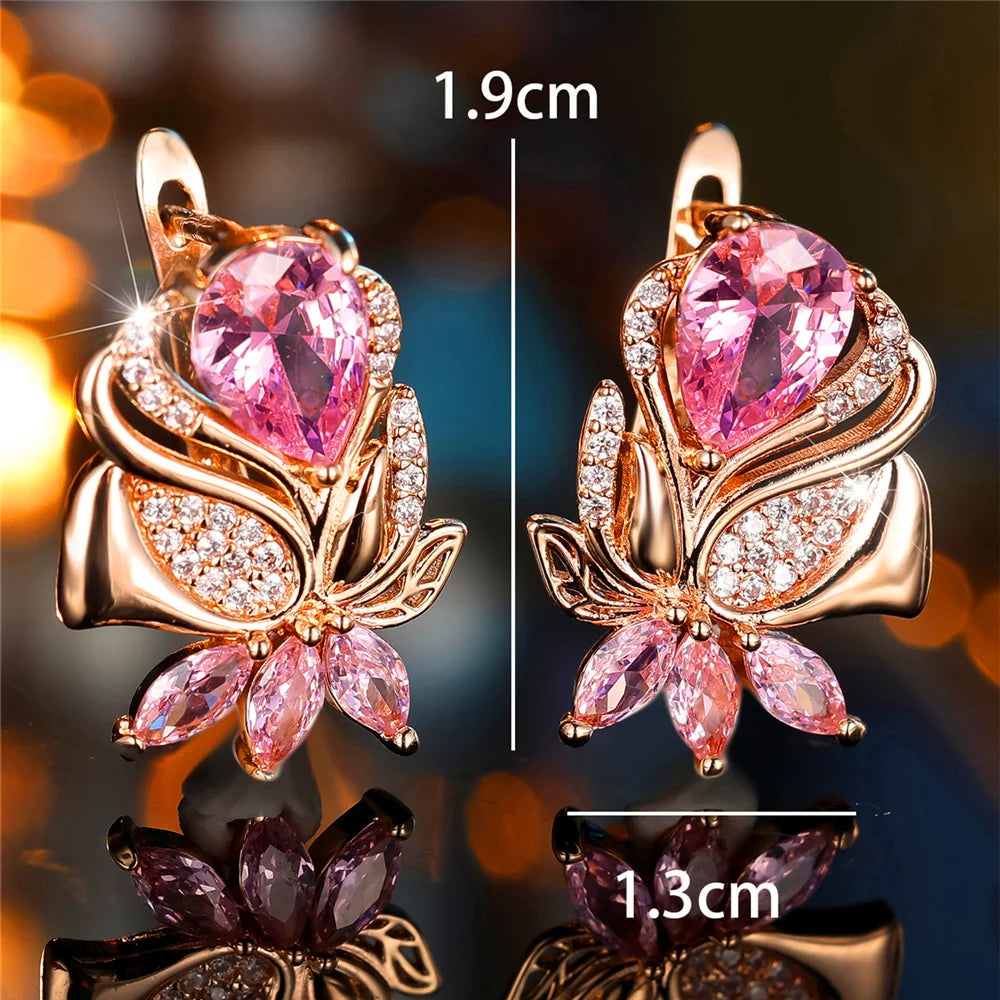 Luxury pink cubic zirconia hoop earrings from Corporación Turística featuring elegant round stone design.