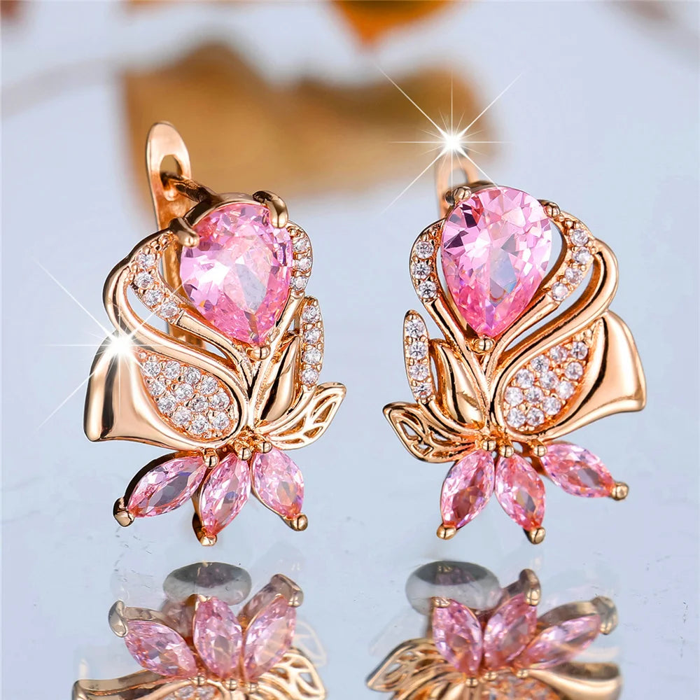 Luxury pink cubic zirconia hoop earrings from Corporación Turística featuring elegant rose-colored stones and a stylish design.