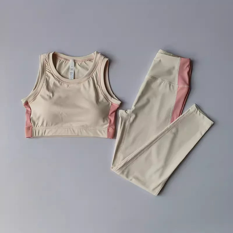 Pink 2-piece women's yoga set with leggings and top from Corporación Turística, ideal for active wear and yoga practice.