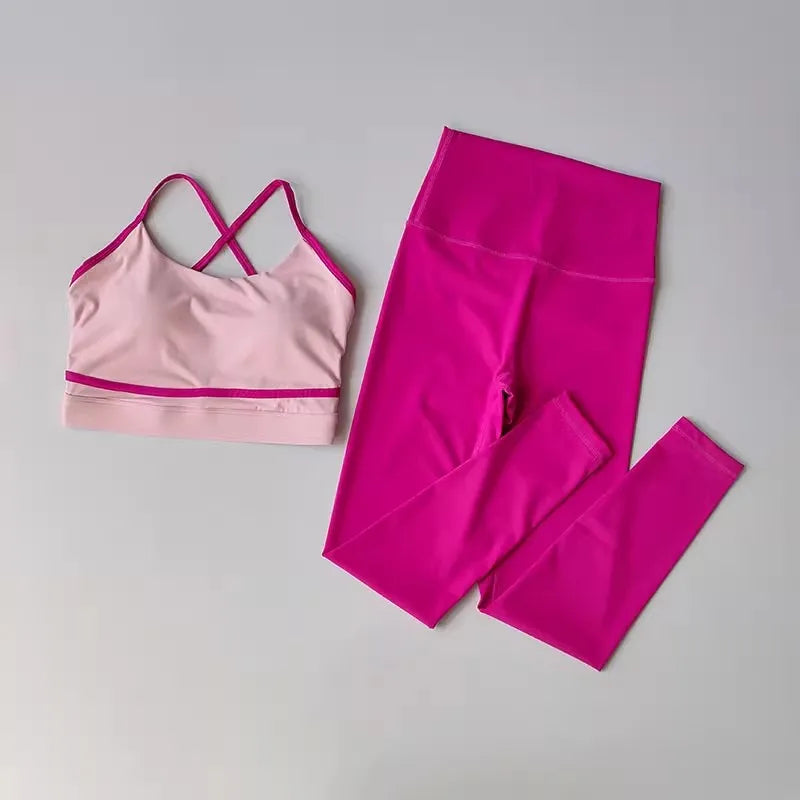 Pink women's yoga set with leggings and top, 2-piece exercise outfit from Corporación Turística, designed for comfort and flexibility.