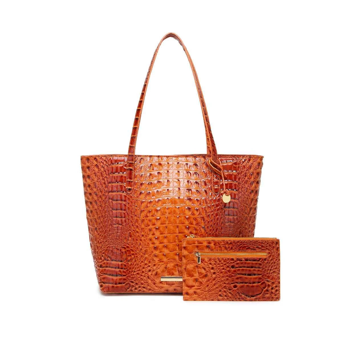 Set of textured leather handbags in various sizes from Corporación Turística, featuring a stylish, relief design.