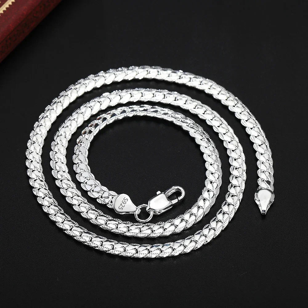 Lateral complete 6mm silver and gold-plated 925 sterling silver bracelet by Corporación Turística, featuring intricate chain links.