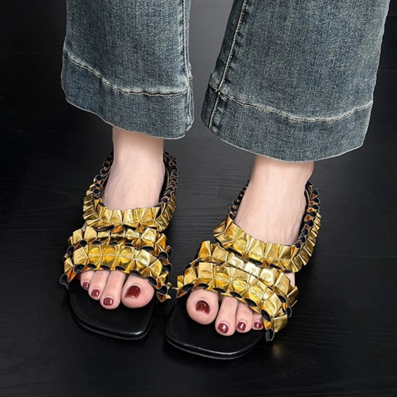 Golden designer pleated sneakers from Corporación Turística, stylish with a sleek, modern look and comfortable fit.