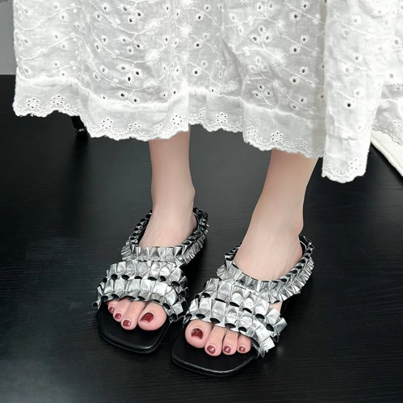 Golden designer pleated sandals from Corporación Turística, stylish and trendy footwear with a sleek finish.