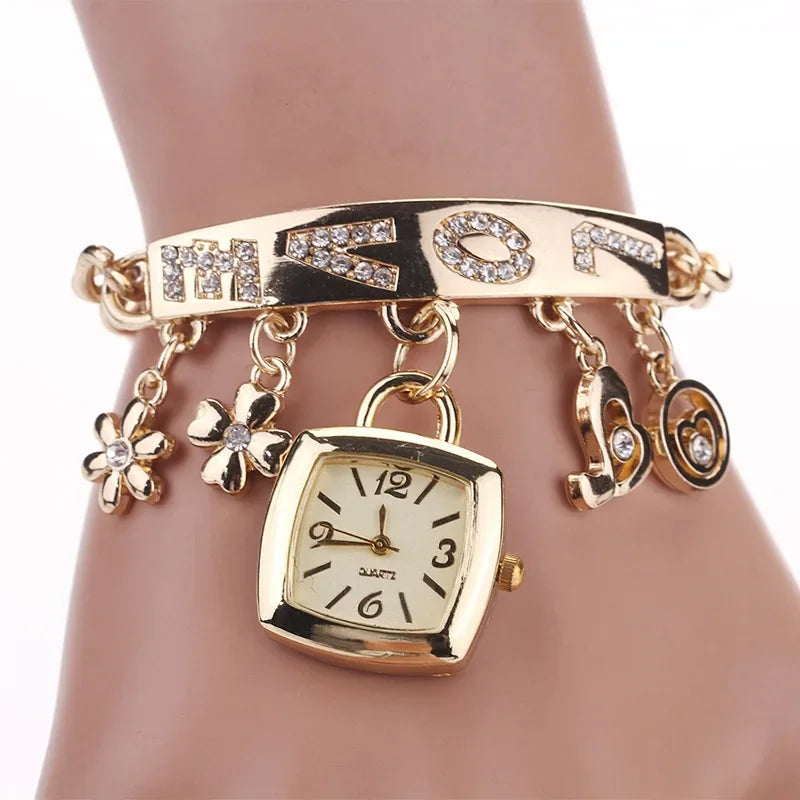 Silver women's letter watch with chain bracelet from Corporación Turística, featuring a stylish and elegant design.