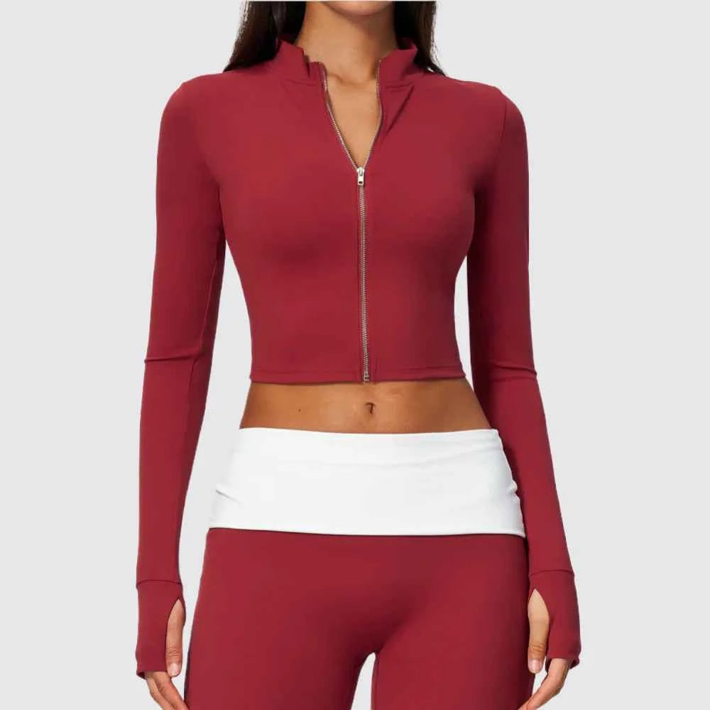 Red women's long-sleeve sports T-shirt with front zipper from Corporación Turística, designed for active wear.