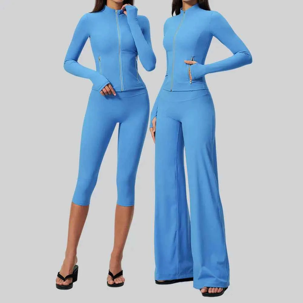 Black women's sports set by Corporación Turística, includes yoga top with long sleeves, suitable for exercise and active wear.