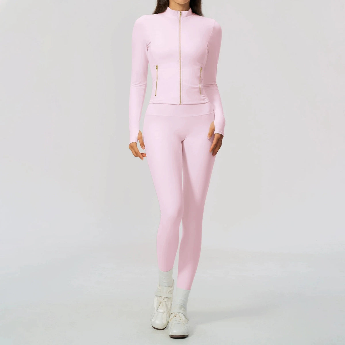 Black women's sports set by Corporación Turística featuring a yoga top with long sleeves and matching athletic pants.