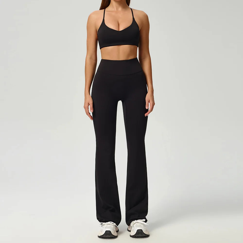 Black 2-piece women's sports set by Corporación Turística featuring a fitted athletic top and matching leggings.
