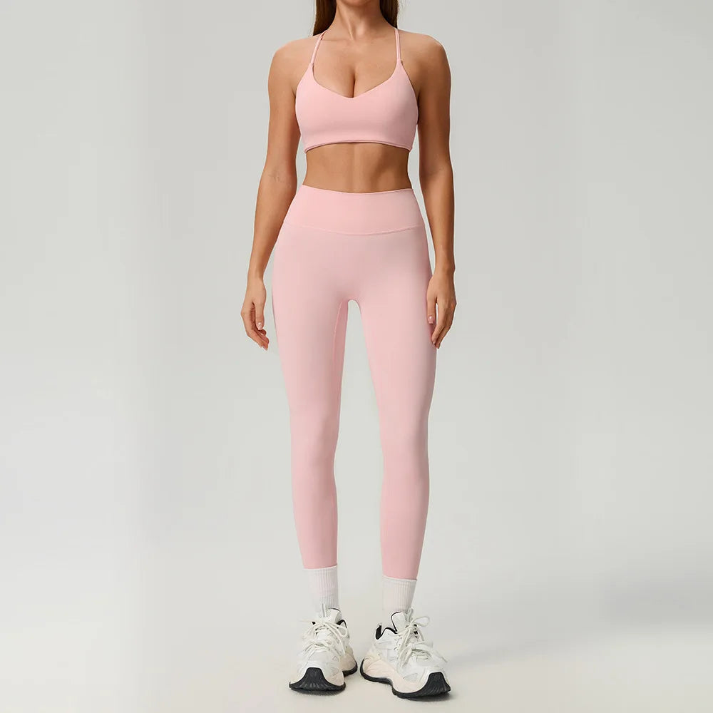 Black 2-piece women's sports set from Corporación Turística, including a sporty top and matching leggings for active wear.